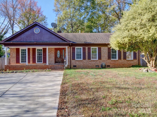 ranch-style home with a front lawn