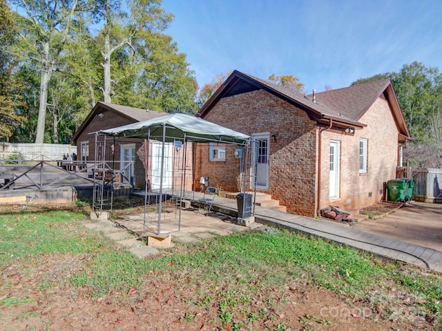 rear view of property with french doors