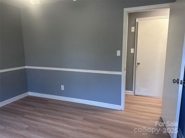 empty room featuring wood-type flooring