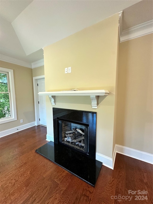 interior details with wood-type flooring and ornamental molding