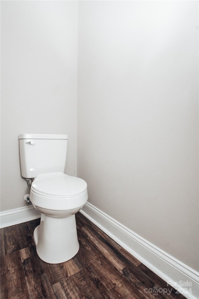 bathroom featuring toilet and hardwood / wood-style flooring