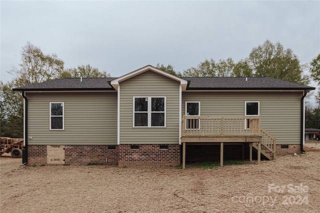 rear view of property with a deck