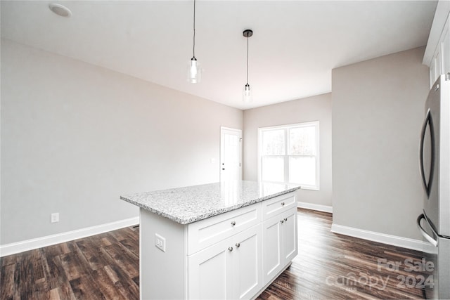 kitchen featuring white cabinets, pendant lighting, dark hardwood / wood-style flooring, and stainless steel refrigerator