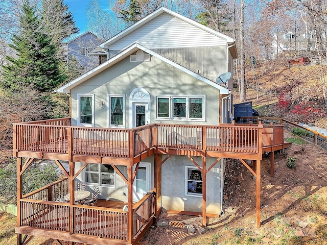 back of house featuring a wooden deck