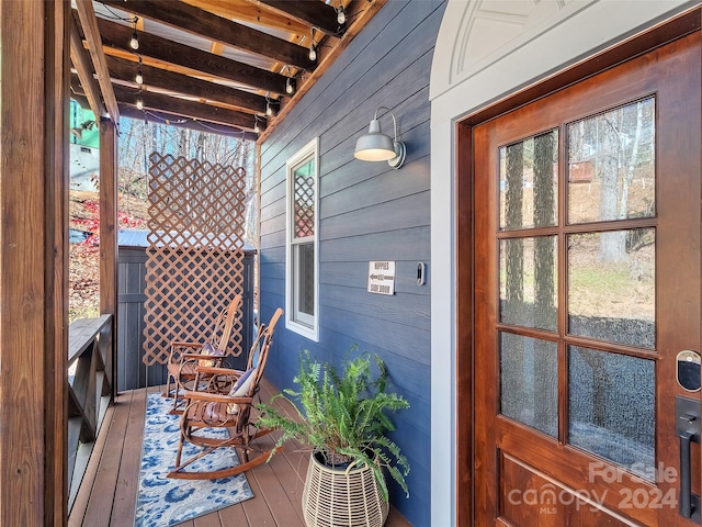 wooden terrace featuring a porch