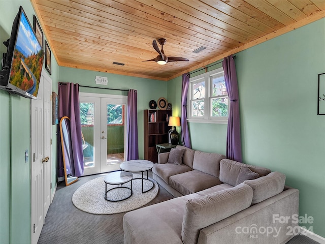 carpeted living room with ceiling fan, wood ceiling, and french doors