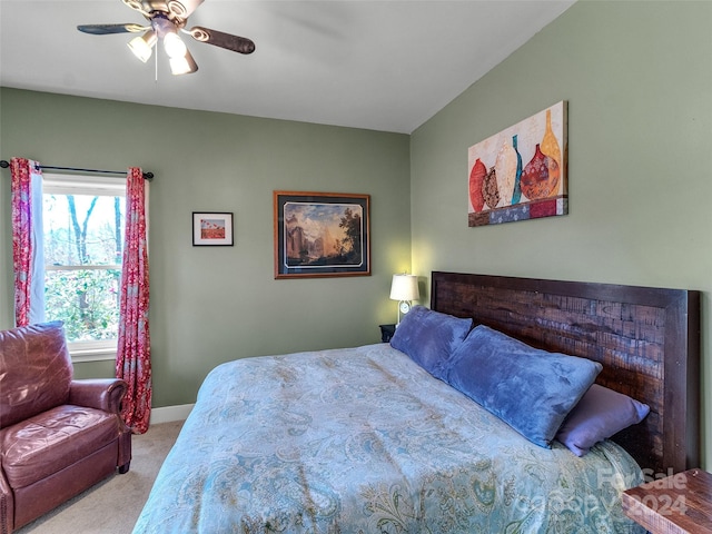 bedroom featuring ceiling fan and light carpet