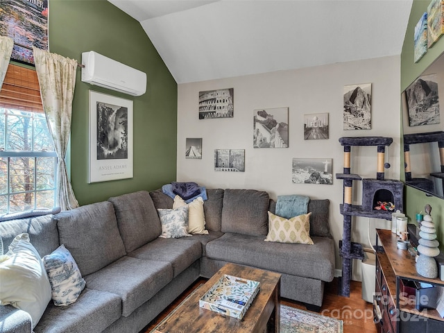 living room featuring vaulted ceiling, dark wood-type flooring, and a wall mounted AC