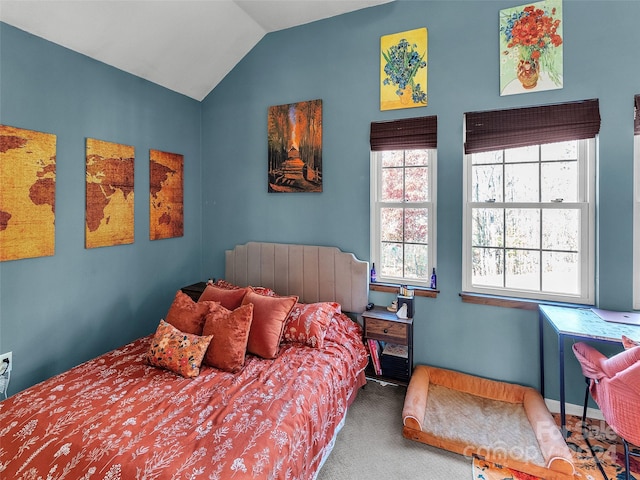 bedroom with carpet flooring and lofted ceiling