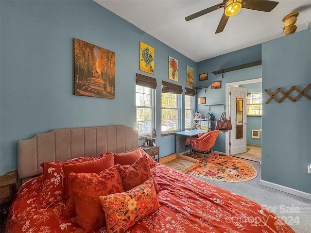 bedroom with ceiling fan and light carpet