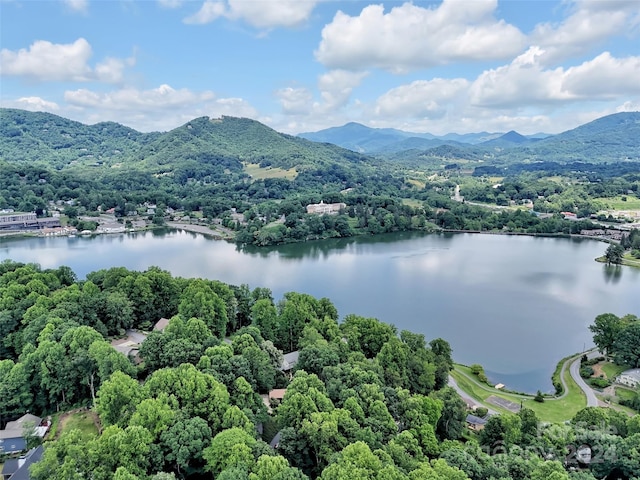 drone / aerial view with a water and mountain view