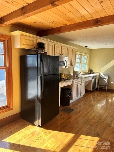 kitchen with light wood-type flooring, wood ceiling, stainless steel appliances, beam ceiling, and hanging light fixtures