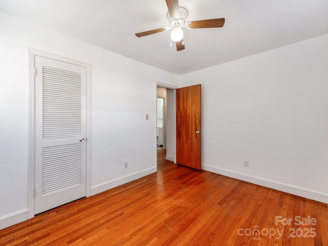 spare room with light hardwood / wood-style flooring and ceiling fan