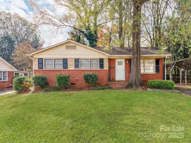 single story home with a front lawn and a carport