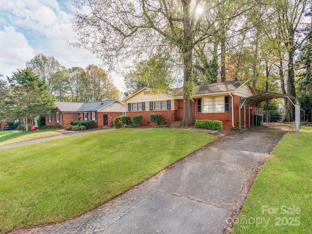 ranch-style house with a front yard and a carport