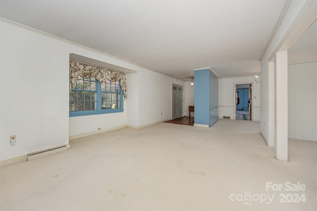 interior space featuring carpet flooring, crown molding, and a baseboard radiator