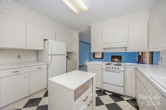 kitchen featuring washer / clothes dryer, crown molding, white cabinets, and white appliances