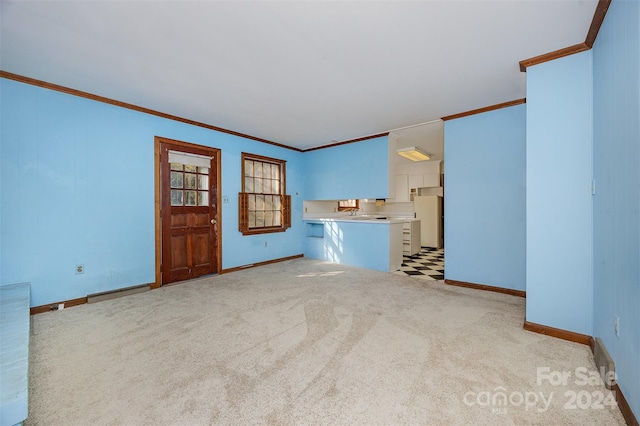 unfurnished living room with crown molding and light colored carpet