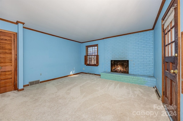 unfurnished living room with crown molding, a fireplace, and carpet floors