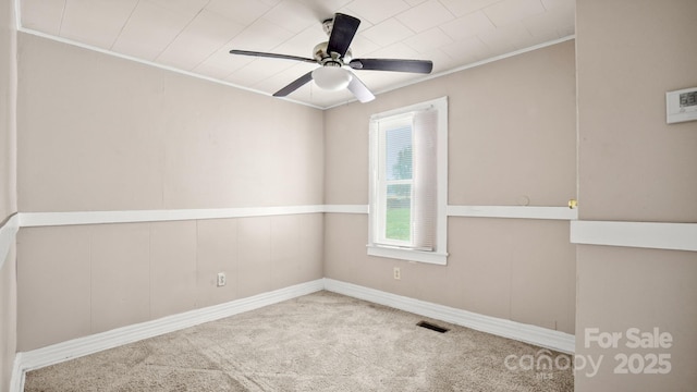 408 E Washington Ave, Bessemer City, NC 28016 - carpeted empty room with ornamental molding, visible vents, and ceiling fan