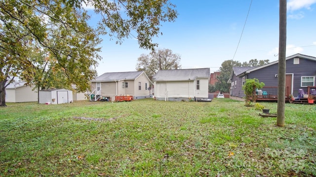 408 E Washington Ave, Bessemer City, NC 28016 - rear view of property with an outdoor structure, a lawn, and a shed