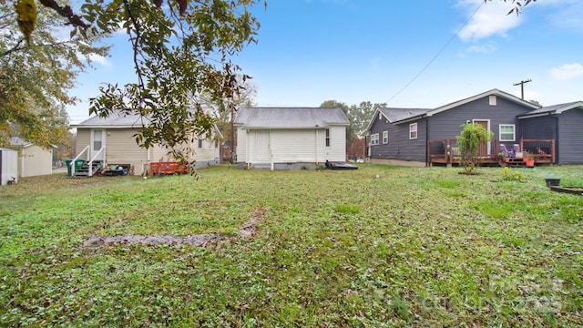 408 E Washington Ave, Bessemer City, NC 28016 - rear view of property featuring entry steps, a yard, a storage unit, a deck, and an outdoor structure