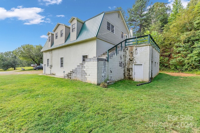 2664 Charles Teague Pl, Lenoir, NC 28645 - view of home's exterior with stairway, a yard, a gambrel roof, and a metal roof