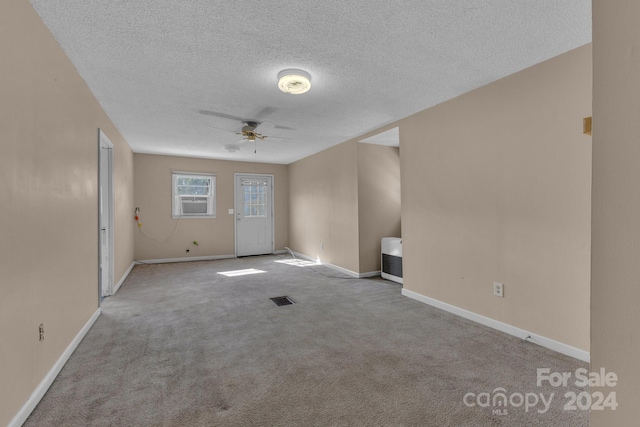 2664 Charles Teague Pl, Lenoir, NC 28645 - empty room with a textured ceiling, carpet, and a ceiling fan