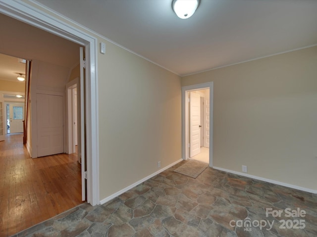 unfurnished room with ornamental molding and hardwood / wood-style floors