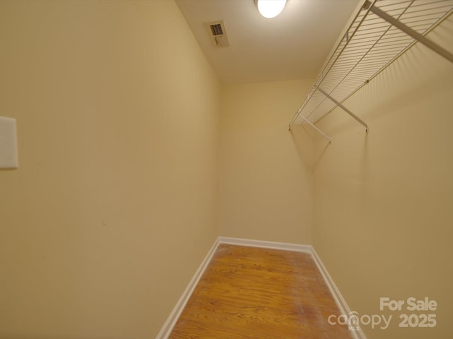 spacious closet featuring wood-type flooring