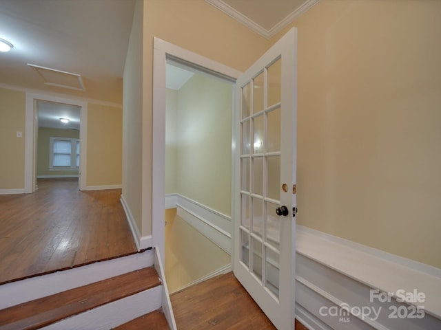 hall with hardwood / wood-style flooring and ornamental molding