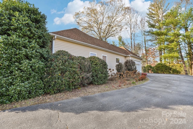 view of property exterior with a garage