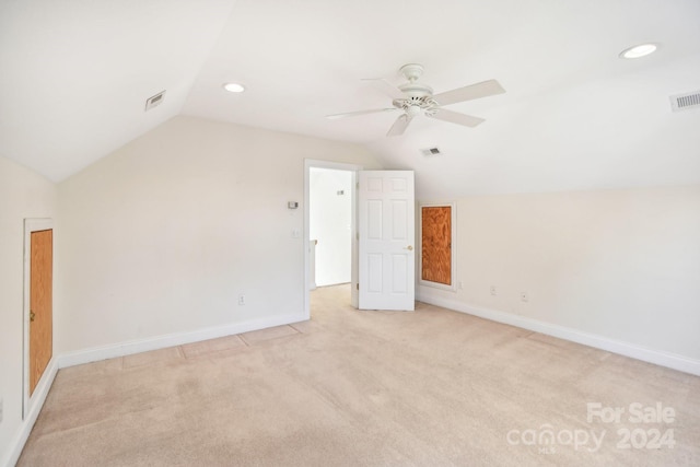 bonus room featuring light colored carpet, ceiling fan, and lofted ceiling