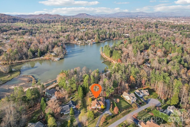 drone / aerial view featuring a water and mountain view