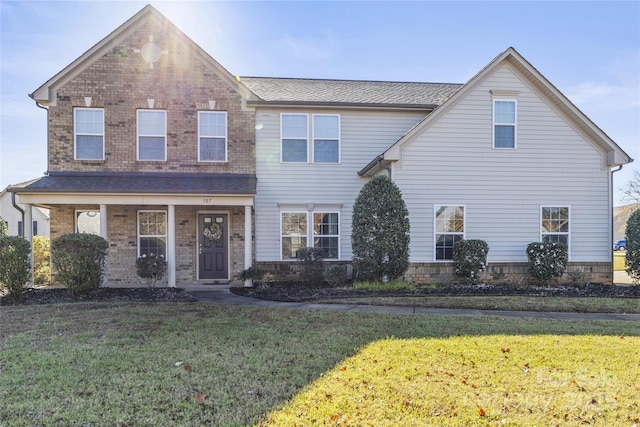 view of front property with a porch and a front lawn