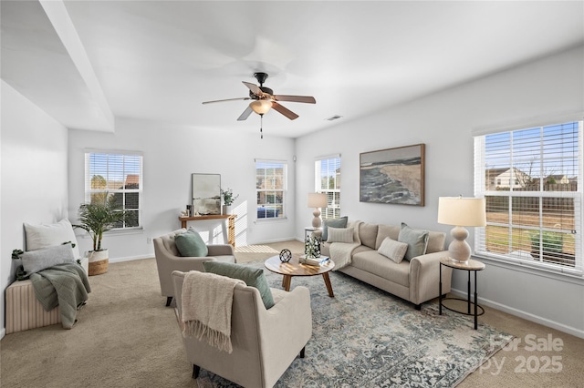 living room with light colored carpet and ceiling fan