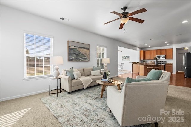 living room featuring ceiling fan