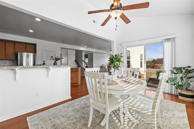 dining room featuring ceiling fan and dark hardwood / wood-style floors