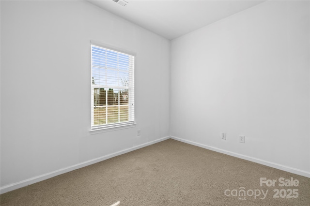 unfurnished room featuring carpet floors