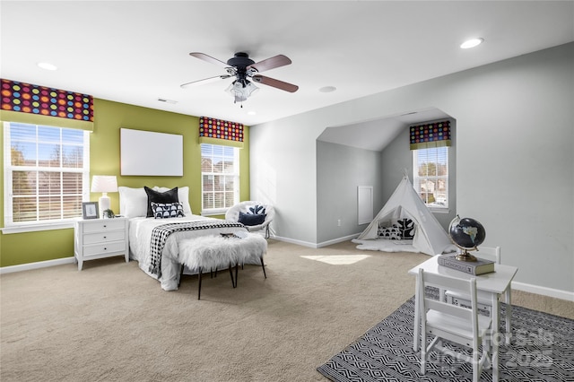 bedroom featuring light carpet and ceiling fan