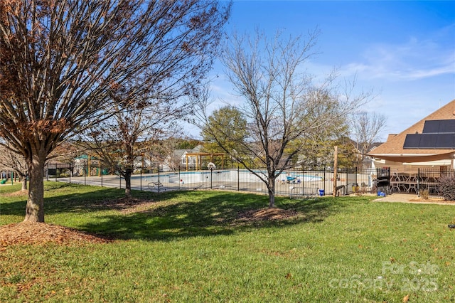 view of yard with a community pool