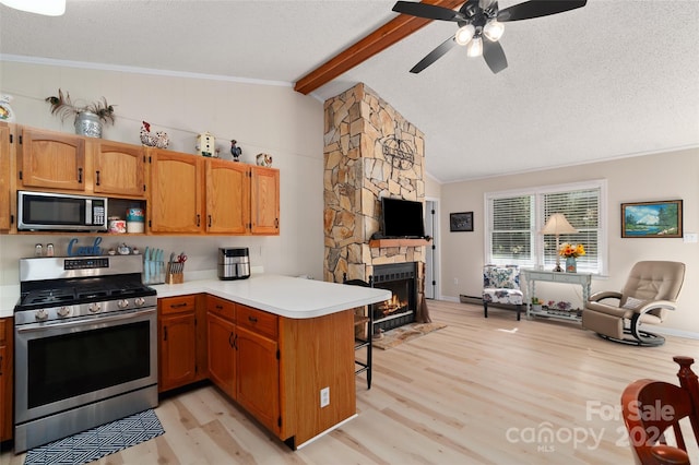 kitchen featuring vaulted ceiling with beams, light hardwood / wood-style floors, kitchen peninsula, and appliances with stainless steel finishes