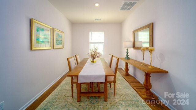 dining room featuring hardwood / wood-style flooring and plenty of natural light