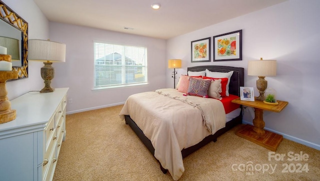 bedroom with light colored carpet