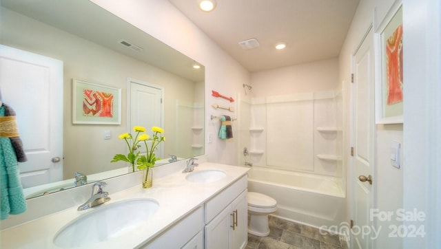 full bathroom with vanity, tub / shower combination, and toilet