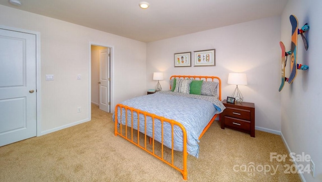 bedroom featuring light colored carpet