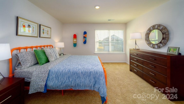 bedroom featuring light colored carpet