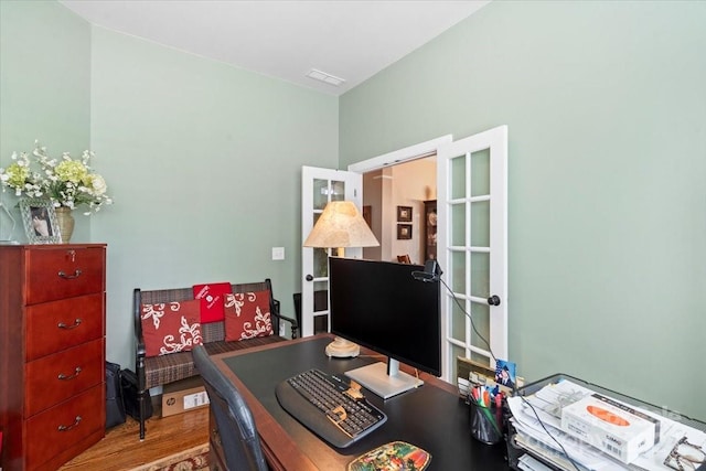 office area with hardwood / wood-style flooring