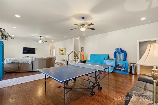 recreation room featuring dark hardwood / wood-style flooring and ceiling fan