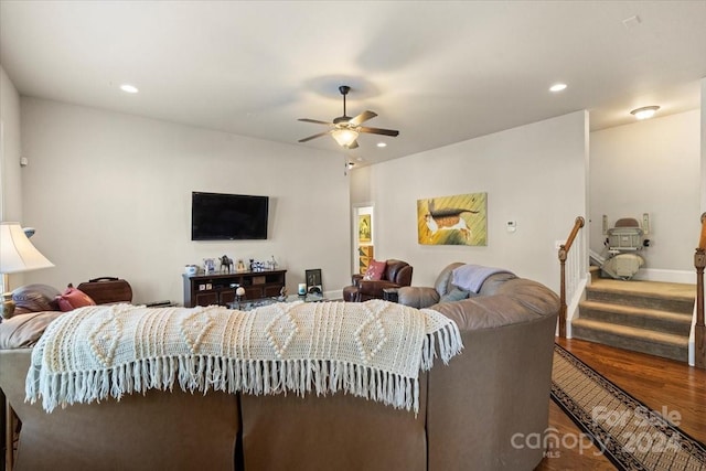 living room with ceiling fan and wood-type flooring